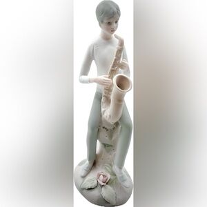 Figurine of a man sitting on a tall Rock w/saxophone-Japanese vintage-Excel Cond